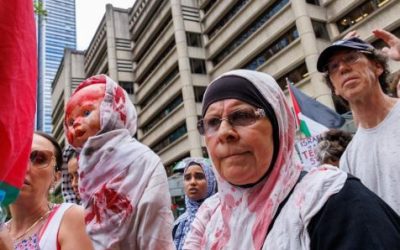 IS SOMEBODY GETTING THEIR JOLLIES WATCHING POLICE PUMMELLED BY DEMONSTRATORS